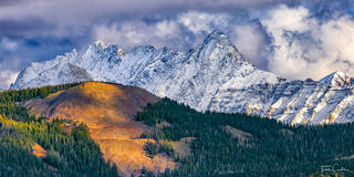 a panoramic photo of mount wilson and el diente peak in the san miguel mountains near telluride colorado