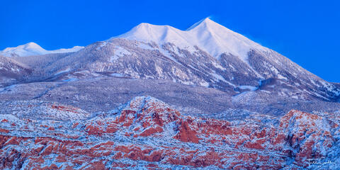 la sal mountains and sandstone cliffs after a winter storm in twilight light