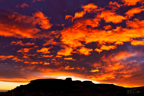 a photo out the bedroom window of a spectacular sunrise over golden, colorado
