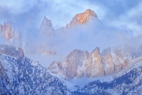 a photo of mount whitney in the sierra nevada range of california surrounded by clouds