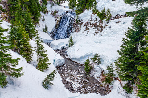 a photo of a creek surrounded by snow in the mount baker area of washington state.