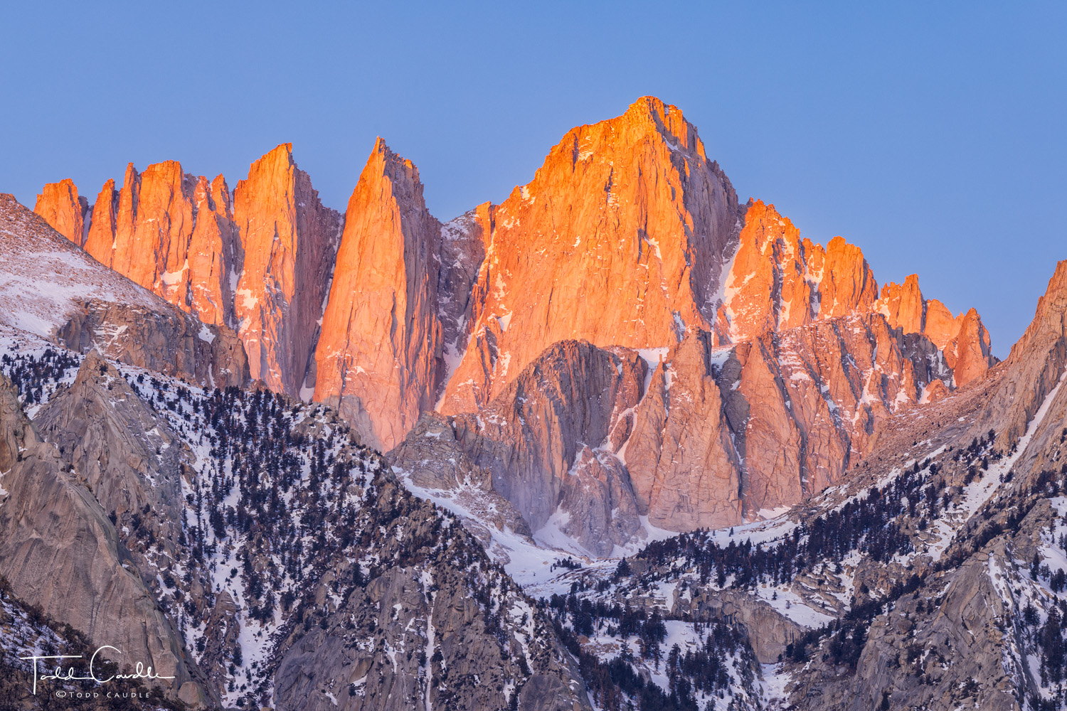 The first blush of sunrise light on Mount Whitney, at 14,505 feet in elevation, the highest peak in the contiguous 48 United...