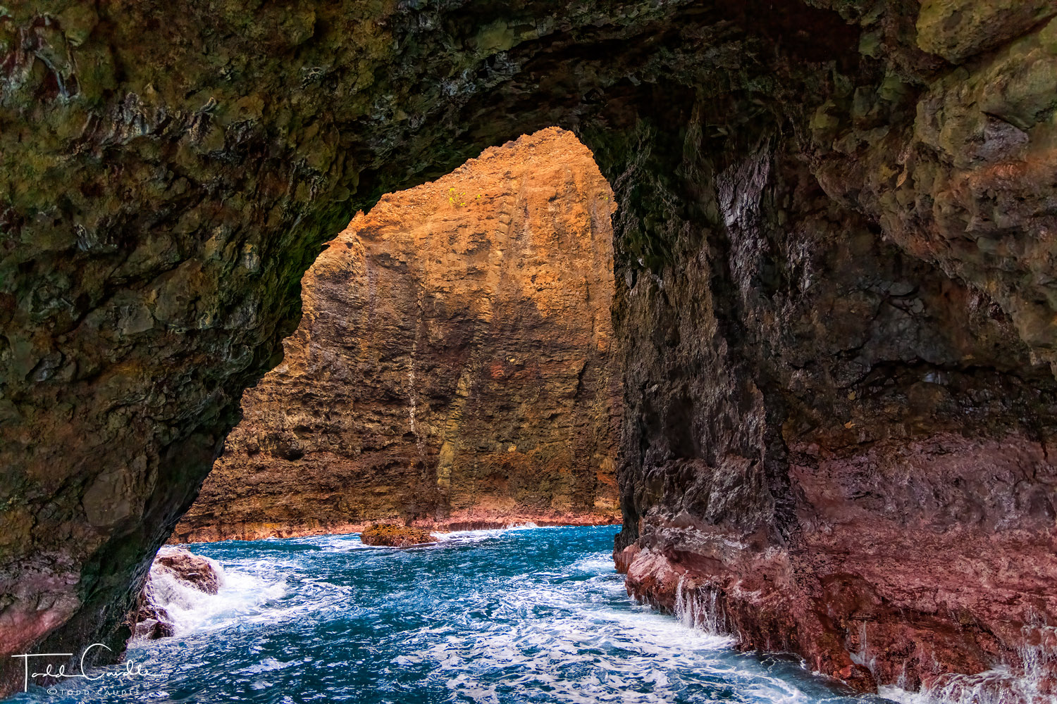 A sea cave along the Na Pali Coast. Our boat captain expertly maneuvered his catamaran into the cave as the waves jostled the...