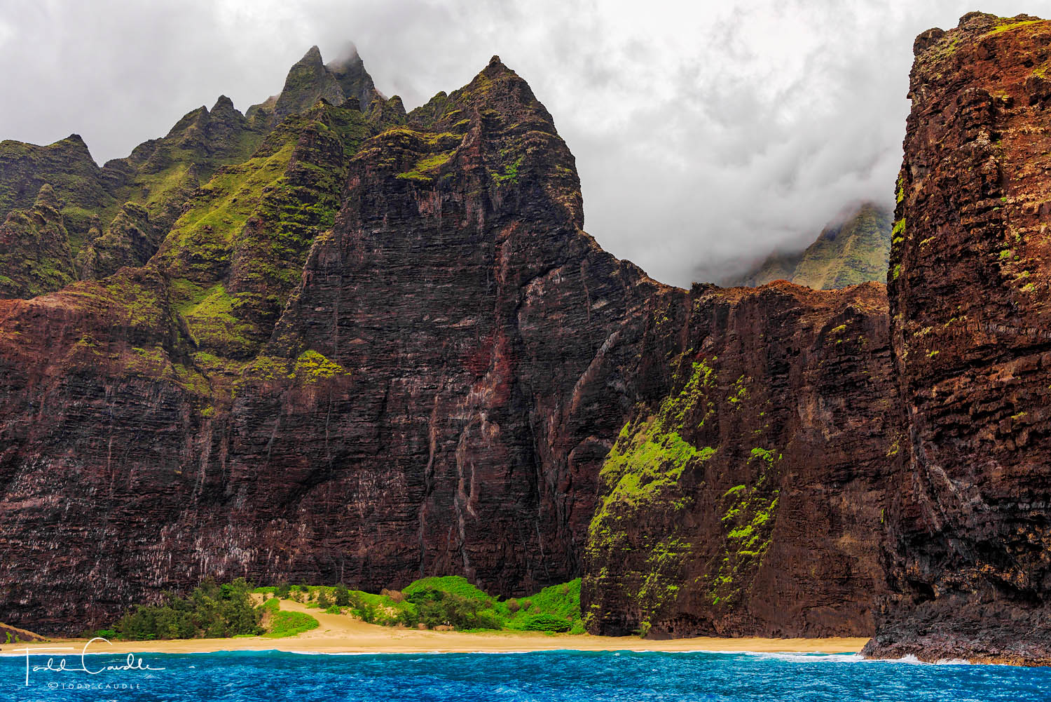 The wild Na Pali Coast and a very secluded beach.