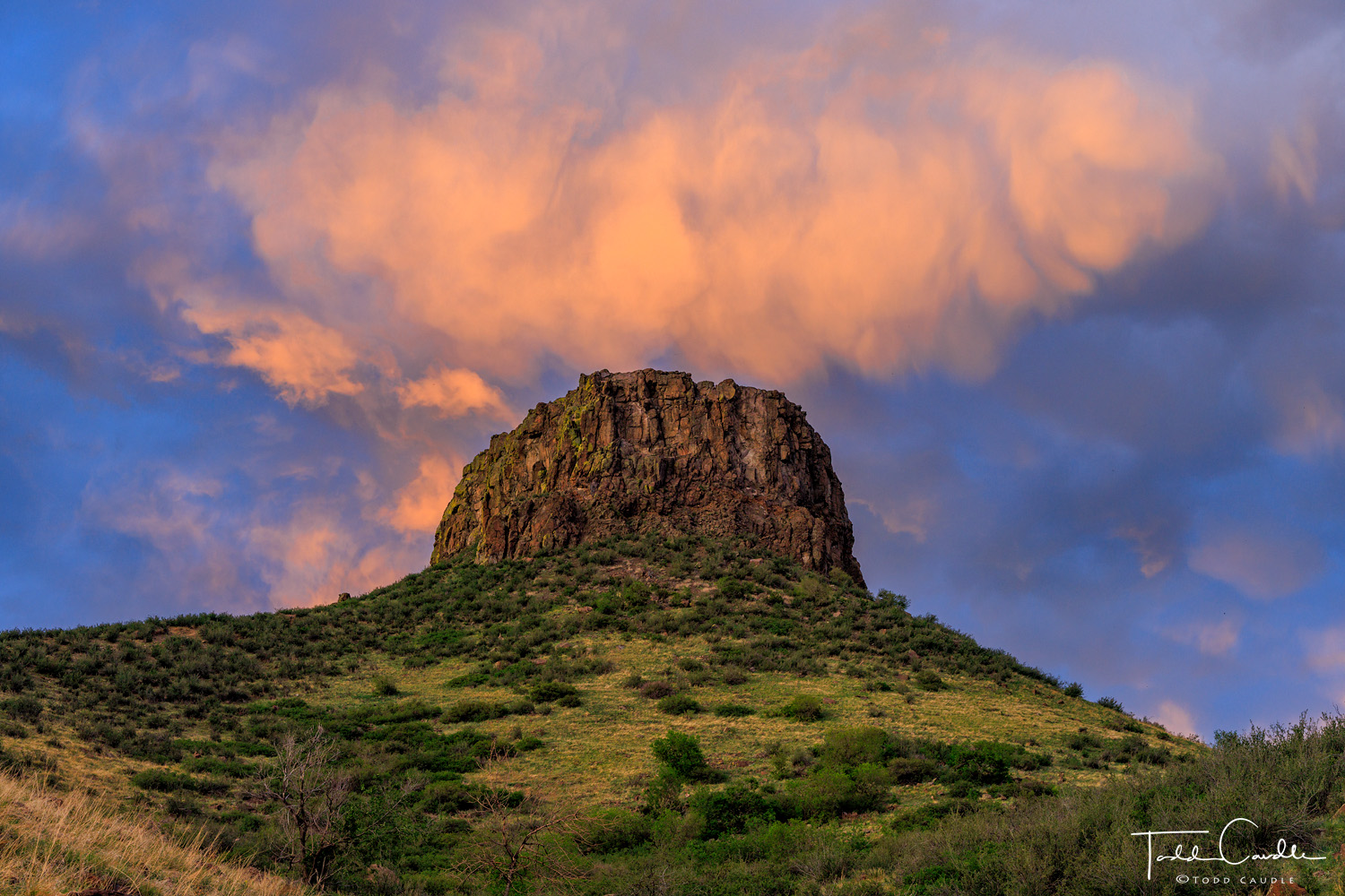 Sunset clouds over Castle Rock, a prominence on South Table Mountain in Golden, and the symbol of the foothills city.