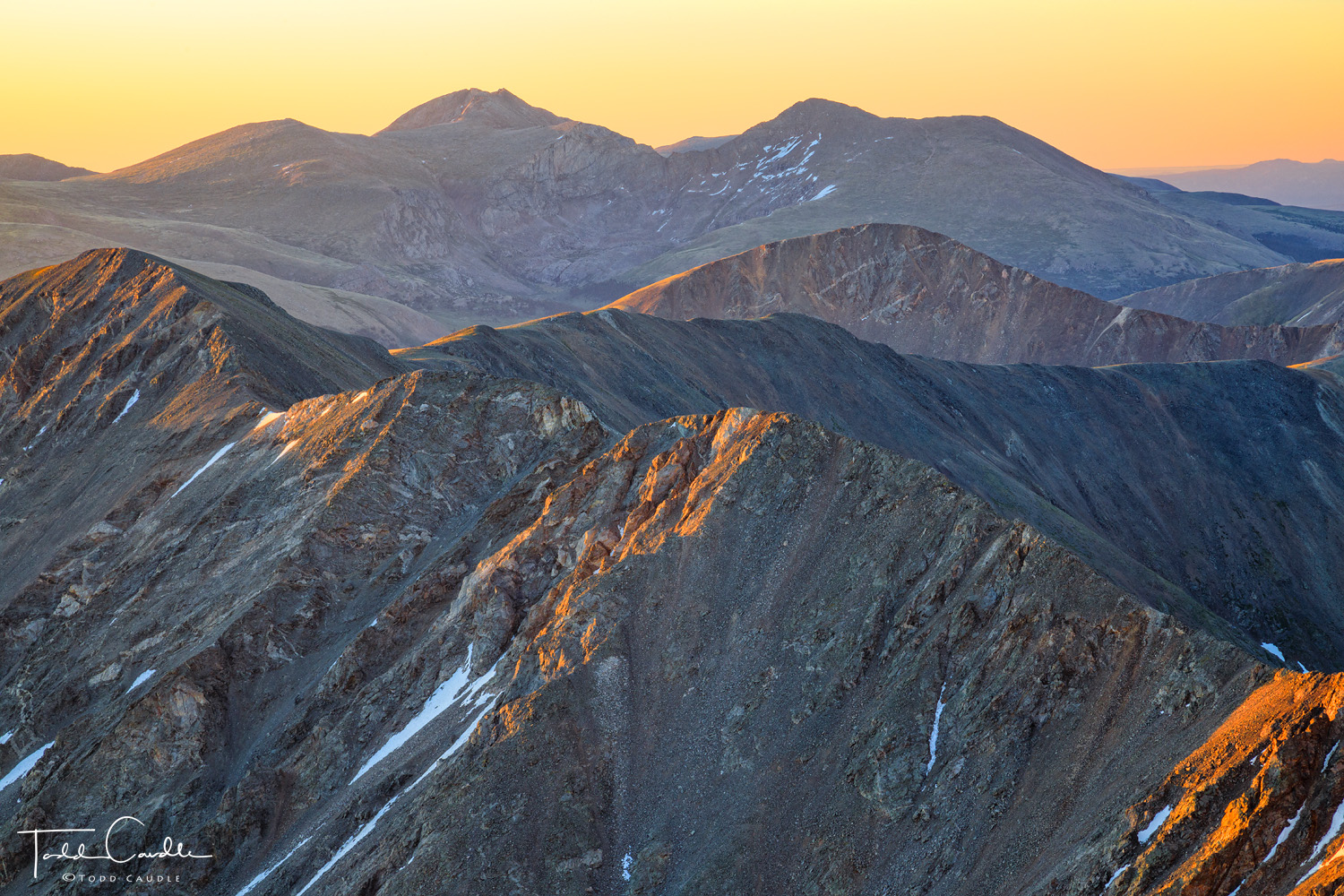 Rugged and rocky ridges lead to this sunrise view of two fourteener summits, Mount Evans & Mount Bierstadt, a visual reward for...