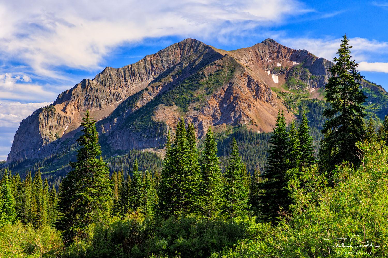 The unusual and dramatic structure of Gothic Mountain rises above the trail to Rustlers Gulch in the Maroon Bells-Snowmass Wilderness...