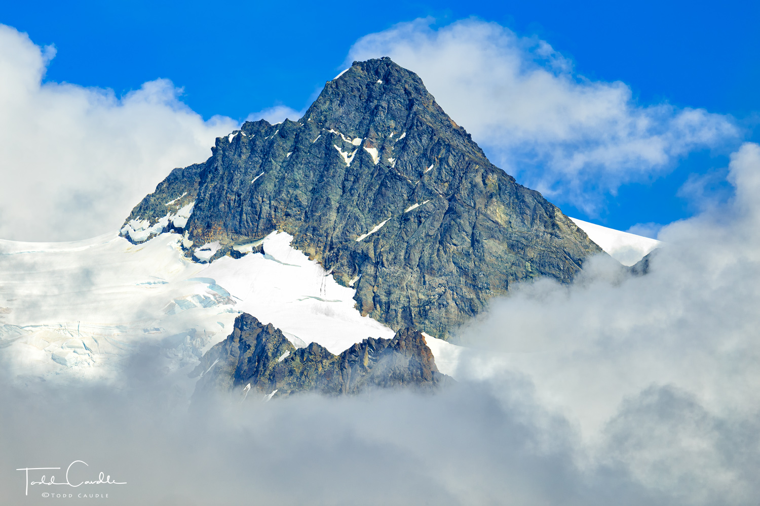 After hiding in the clouds for most of two days, Mount Shuksan's summit pyramid reveals itself.