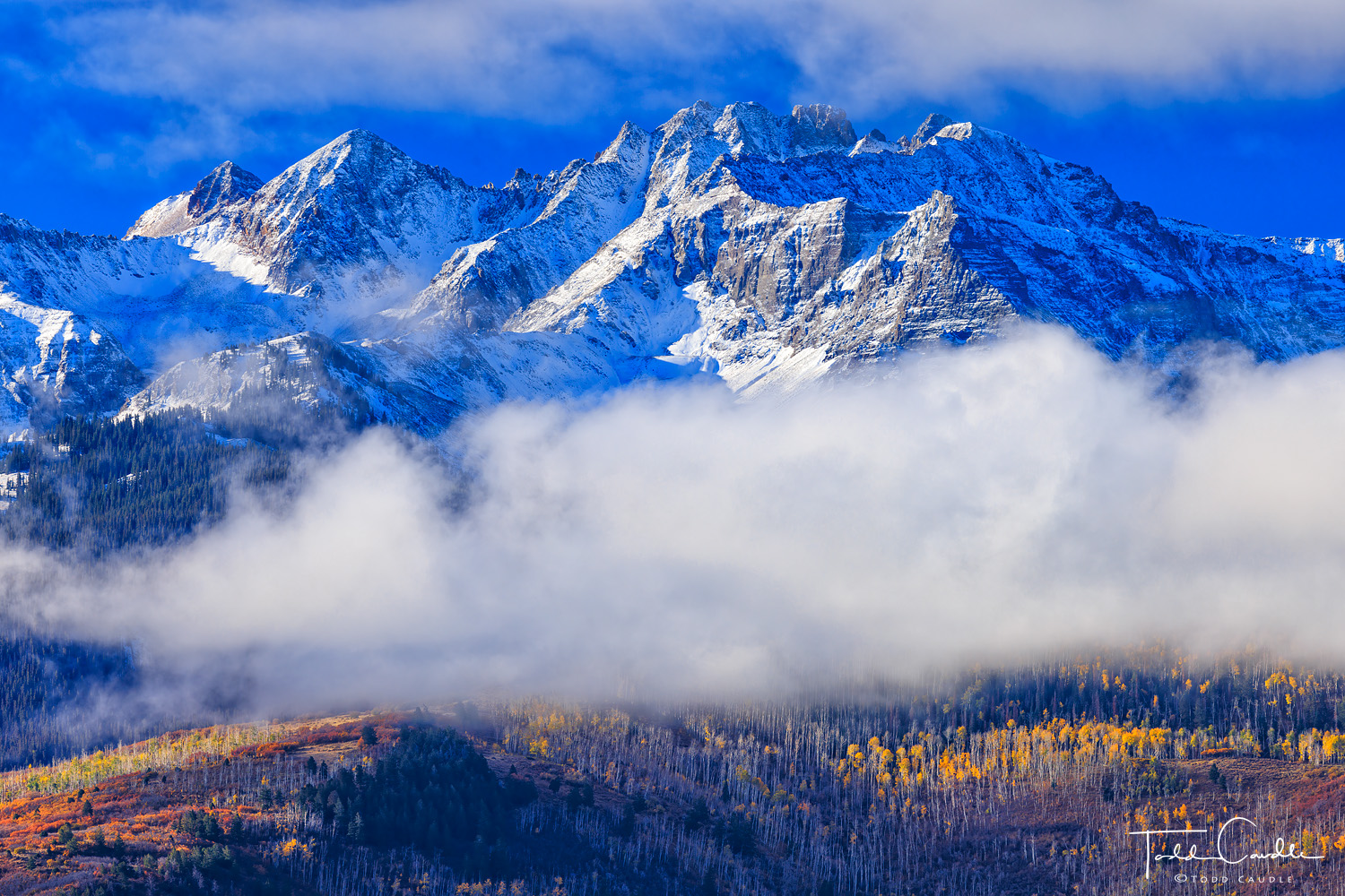 Morning clouds converge on the Sneffels Range. The high peaks hold snow from storms that passed through the area the preceding...