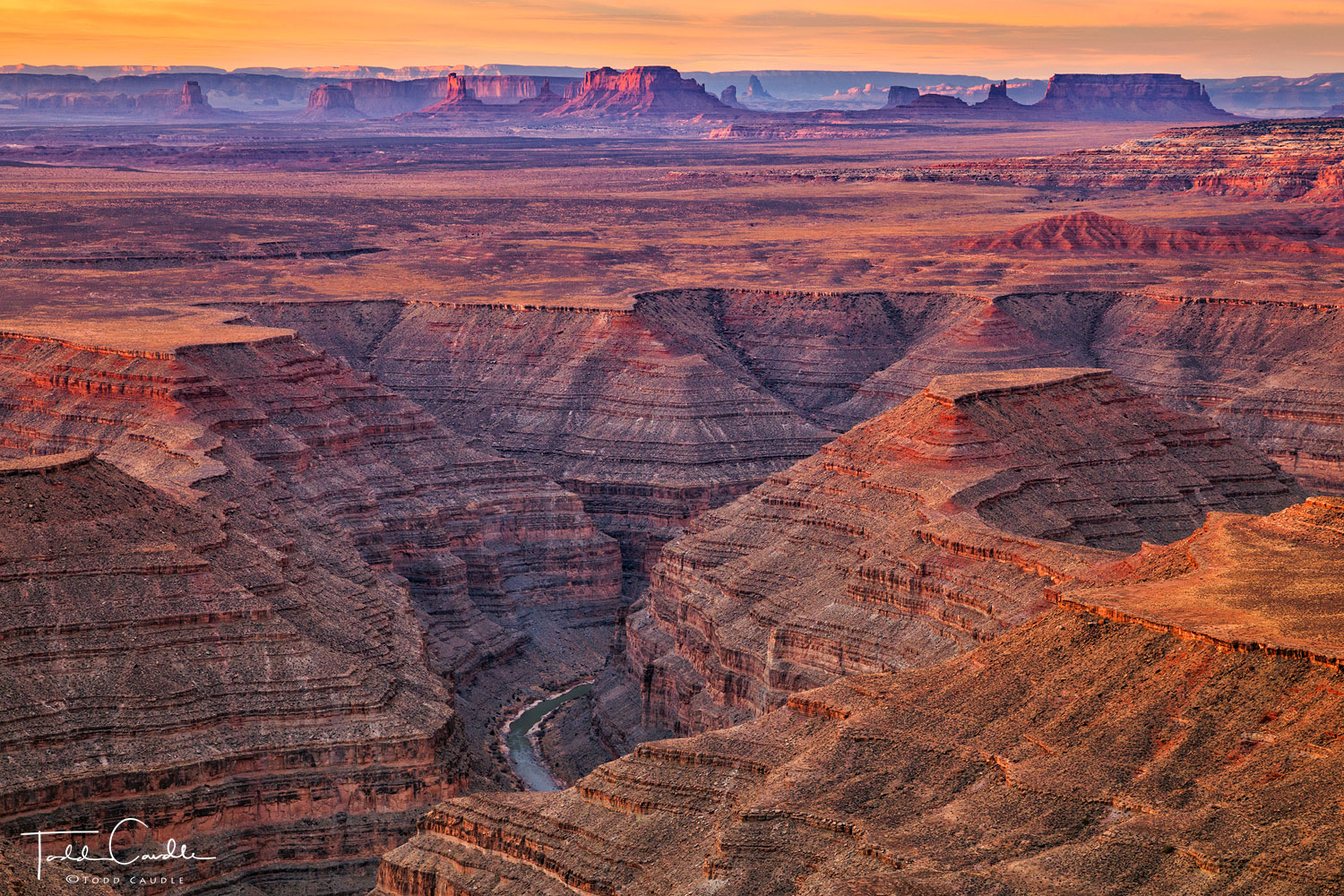 The San Juan River navigates through a series of entrenched meanders, or goosenecks, through layered canyon walls.