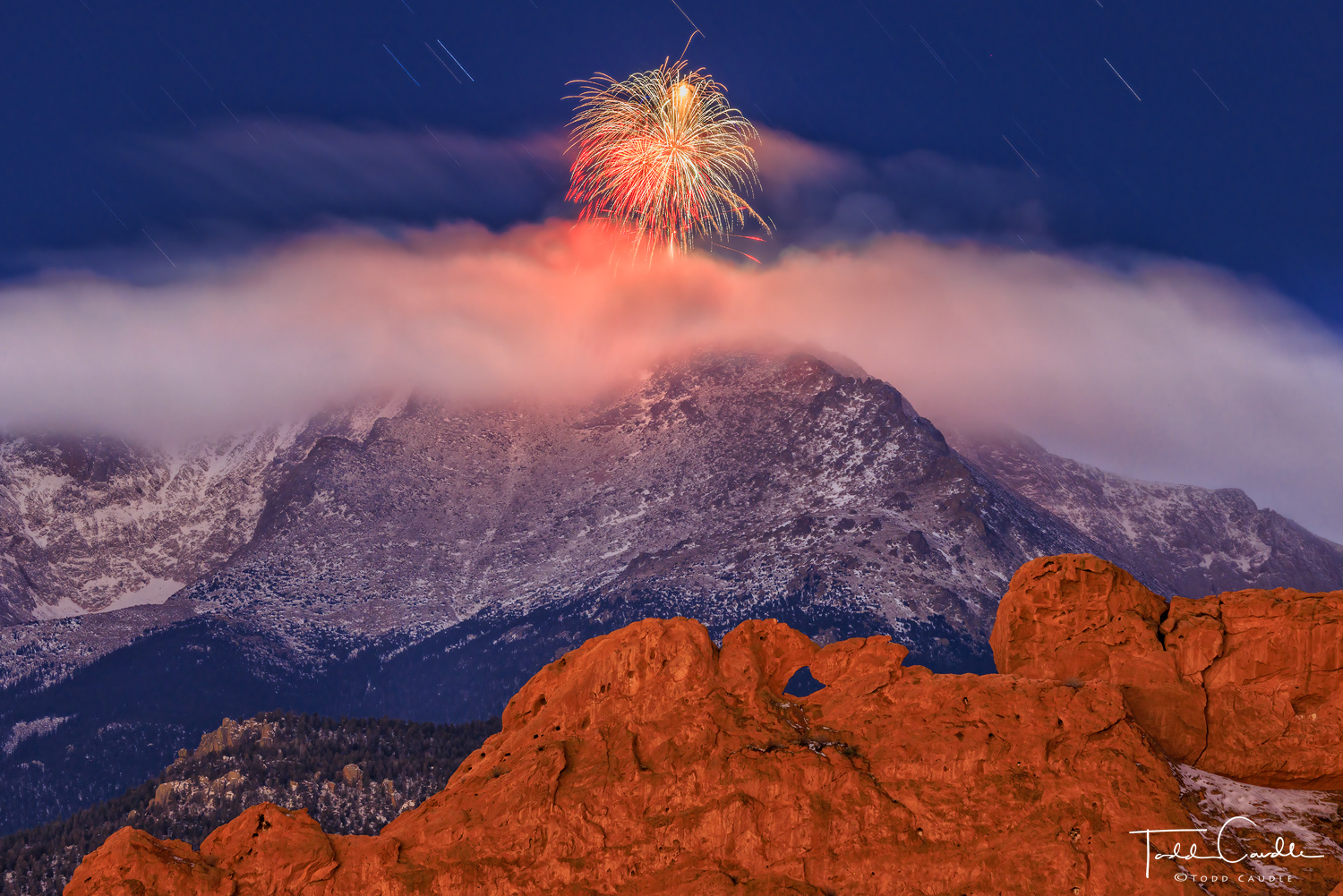 The AdAmAn Club fires celebratory projectiles off the summit of Pikes Peak to greet the New Year, with Kissing Camels in Garden...